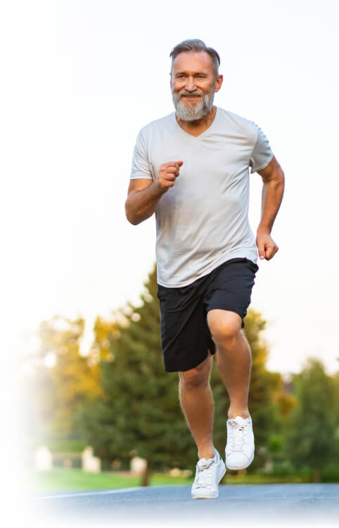 Active older man jogging outdoors